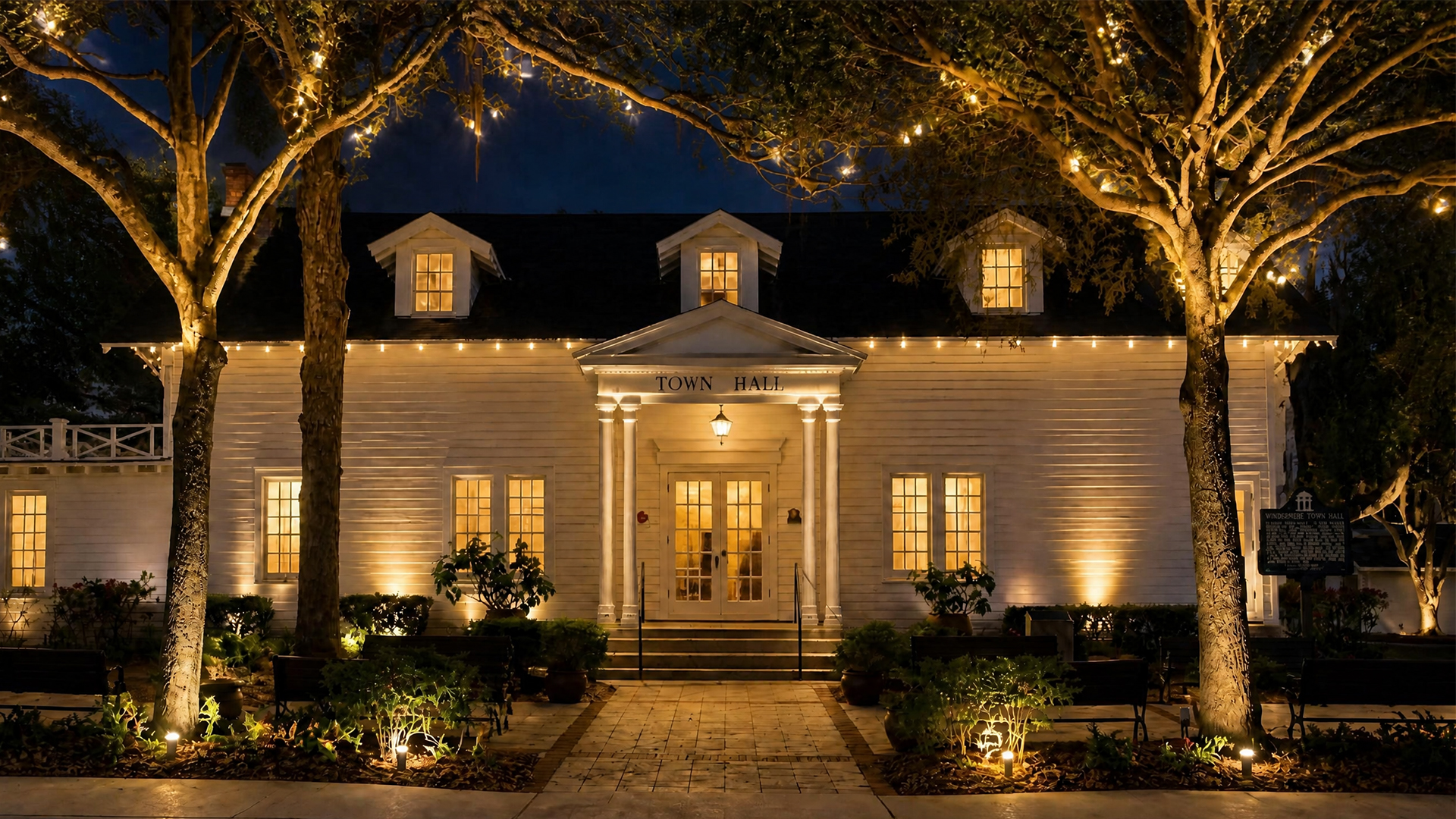 Historic Windermere Town Hall beneath the oaks at night
